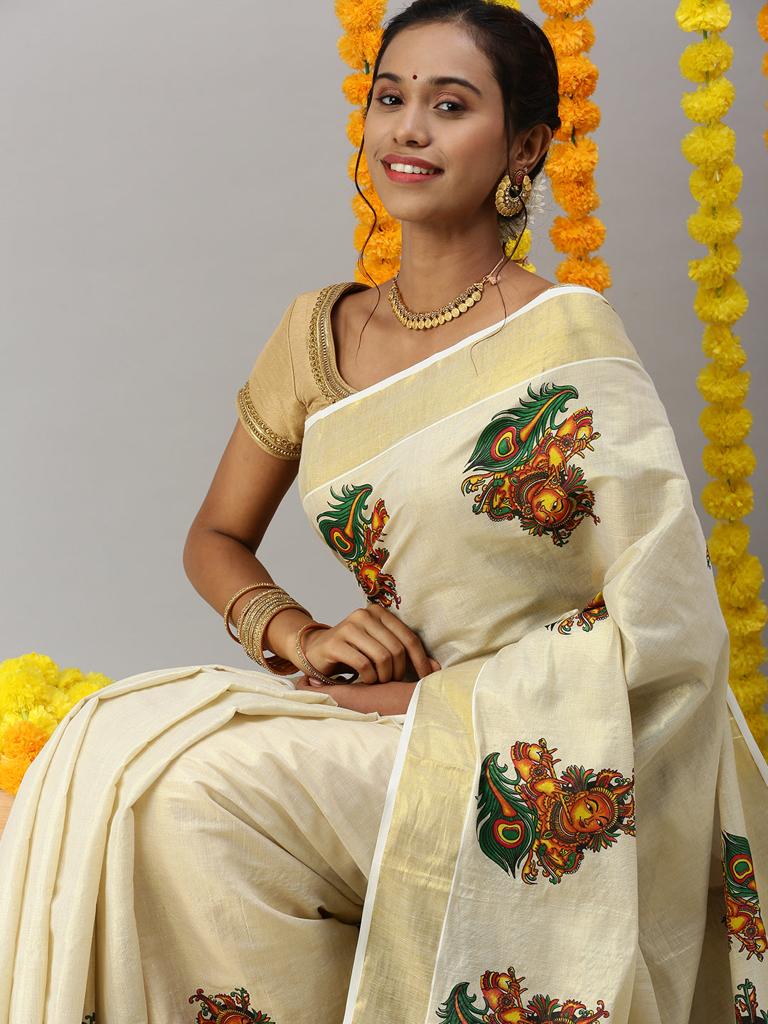 Womens Kerala Tissue Krishna with Flute Printed Gold Jari Border Saree OKS37-Sit view
